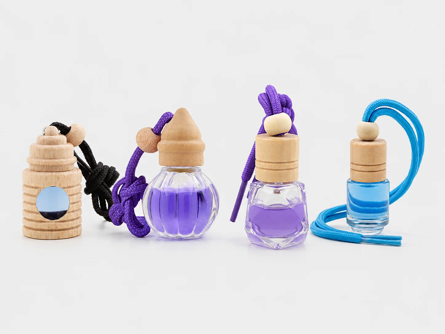 Existing hanging glass car air freshener bottle options with wooden caps and cords