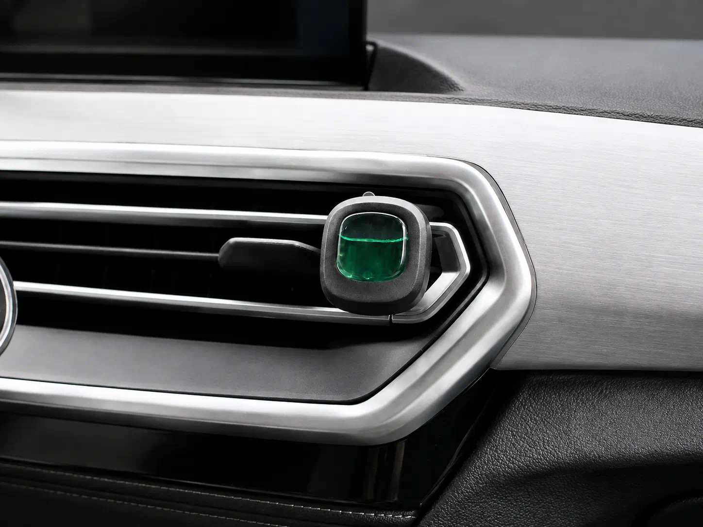Vent clip membrane air freshener installed on a car air vent
